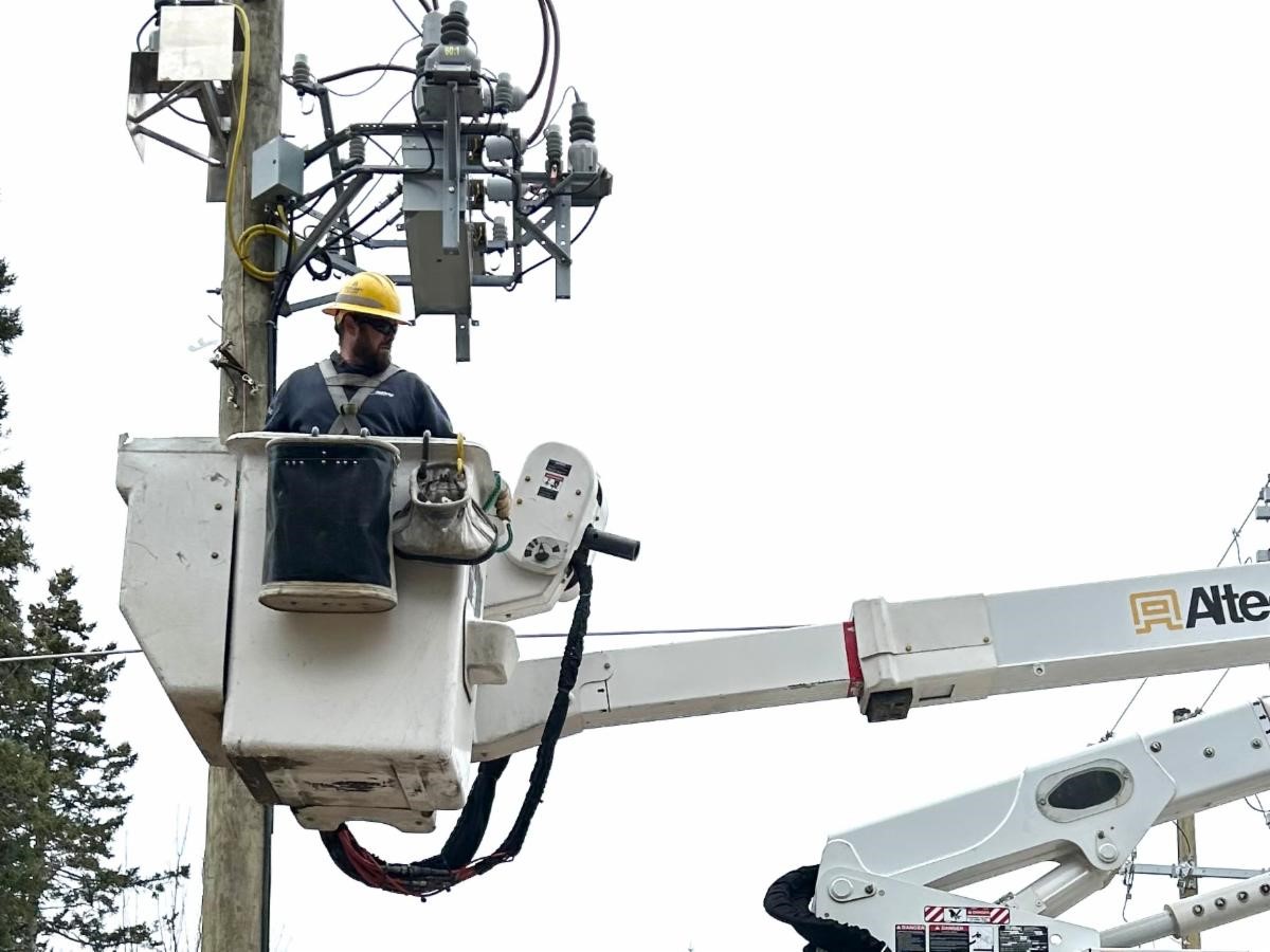 a Versant Power System Technician, energizes one of the new lines at the Tremont substation