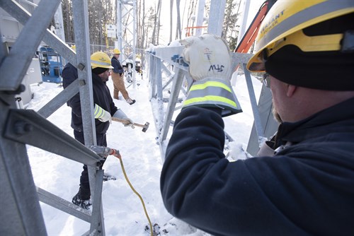 A Versant crew works at University of Maine's east substation