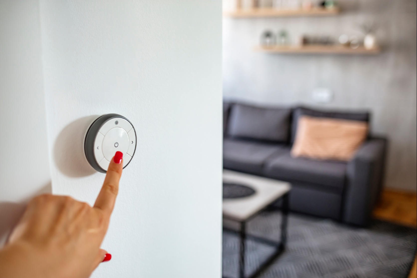 person changing thermostat